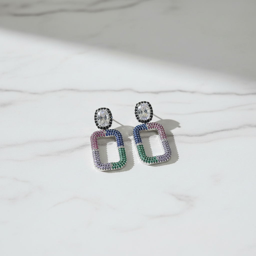 Pastel Rainbow CZ Open Rectangle Earrings – luxury flat lay on marble