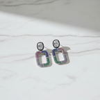 Pastel Rainbow CZ Open Rectangle Earrings – luxury flat lay on marble