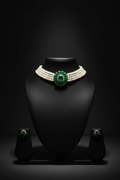 3-strand seed pearl choker with emerald floral AD centrepiece on dark velvet studio display