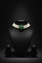 3-strand seed pearl choker with emerald floral AD centrepiece on dark velvet studio display