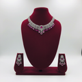 Fuchsia pink AD floral fringe choker set on burgundy velvet display