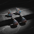 Multicolour CZ Lotus Fan Jhumka Gunmetal Earrings – luxury flat lay