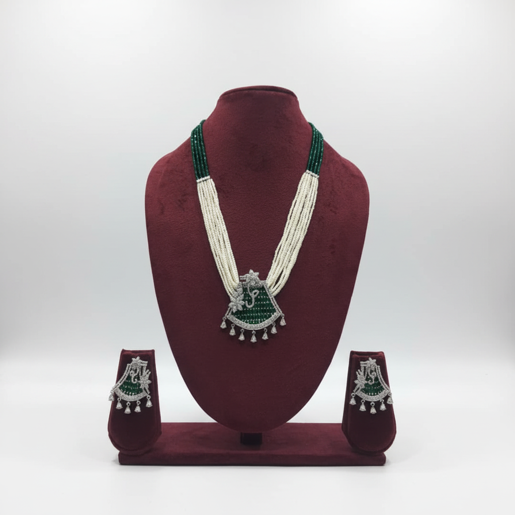 Pearl and emerald bead AD peacock pendant long necklace set on burgundy velvet display