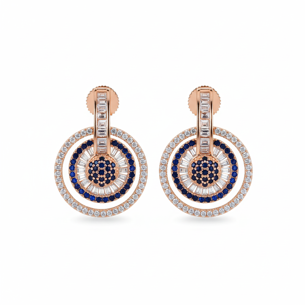 Sapphire blue circle drop earrings on white background studio shot