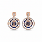 Sapphire blue circle drop earrings on white background studio shot