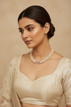 Bridal lifestyle — model wearing double-strand champagne pearl and AD X-link necklace with bow clasp