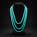 5-strand turquoise rondelle bead necklace on dark velvet studio display
