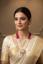 Bridal lifestyle — model wearing ruby pink bead and pearl gold polki pendant long necklace set