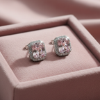 Blush pink CZ cushion rectangle halo stud earrings on dusty rose velvet - luxe editorial style