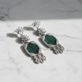 Emerald Green CZ White Marquise Heart Shield Chandelier Earrings – luxury flat lay on marble