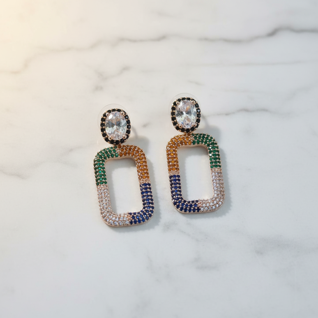 Rainbow CZ Open Rectangle Earrings – luxury flat lay on marble