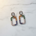 Rainbow CZ Open Rectangle Earrings – luxury flat lay on marble