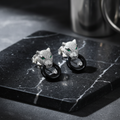 CZ Panther Head Earrings – luxury flat lay on black marble