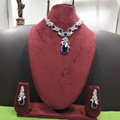 Sapphire blue floral AD necklace set on burgundy velvet display