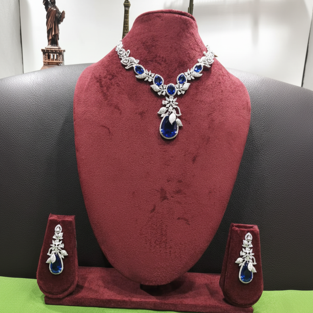 Sapphire blue floral AD necklace set on burgundy velvet display