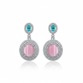 Pink cat's eye double halo drop earrings on white background studio shot