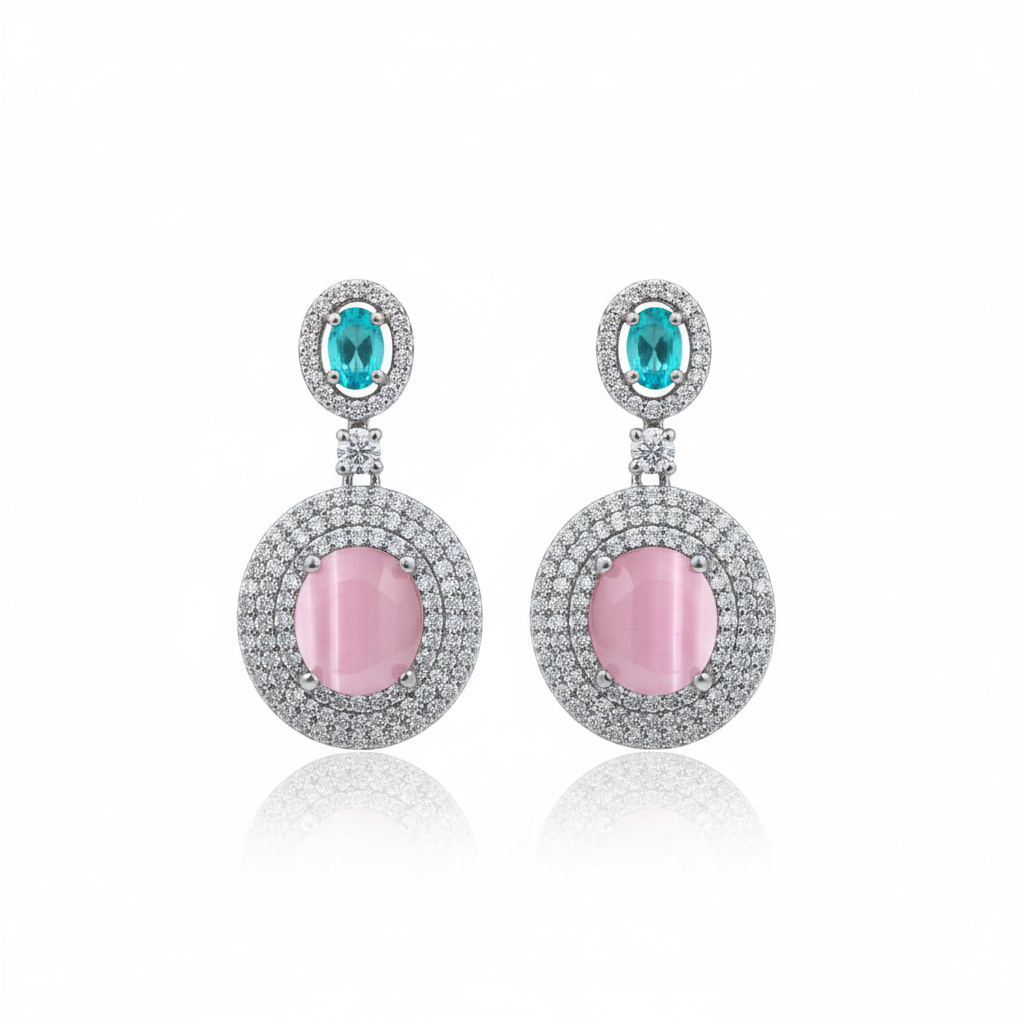 Pink cat's eye double halo drop earrings on white background studio shot