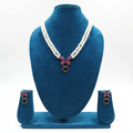 Double-strand pearl and ruby pink AD butterfly bow emerald heart pendant necklace set on navy velvet display