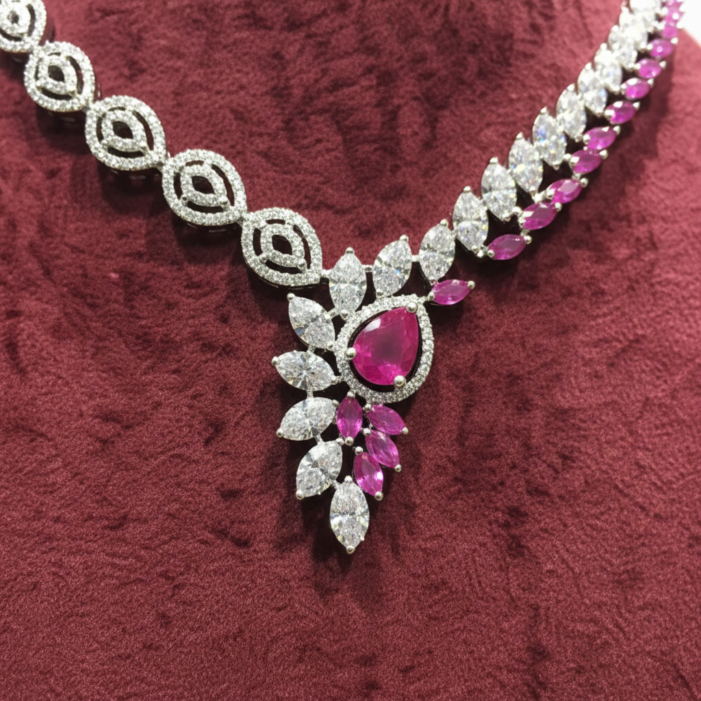 Close-up macro of leaf motif and pink ruby teardrop pendant