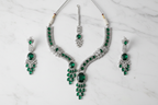 Emerald AD Necklace Set flat lay on marble
