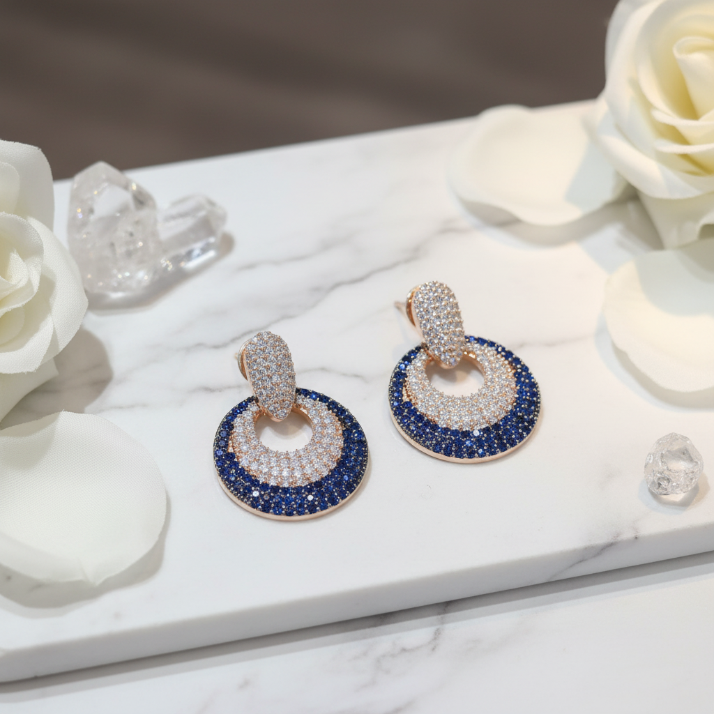 Sapphire Blue CZ Open Circle Earrings – luxury flat lay on marble