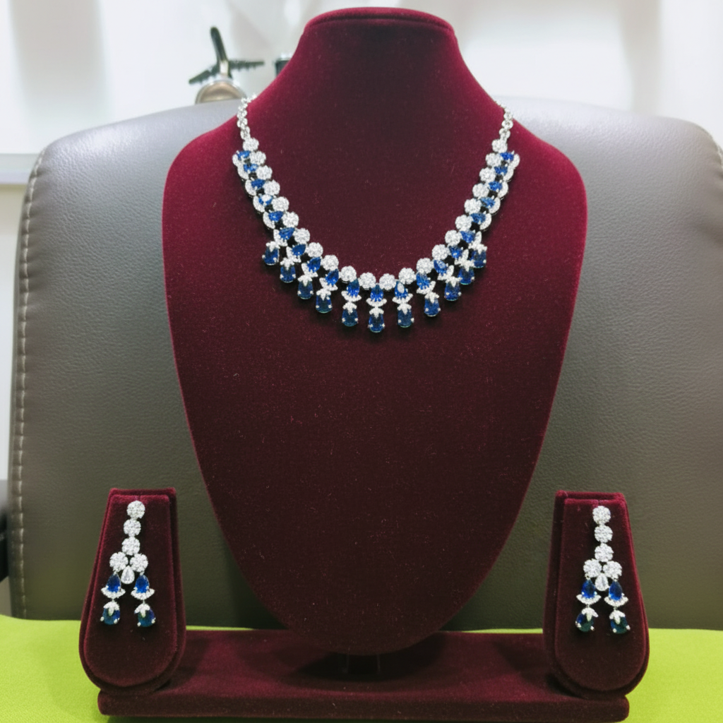 Sapphire blue AD double-row fringe necklace set on burgundy velvet display