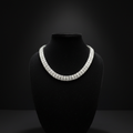 White AD diamond tennis necklace on dark velvet studio display