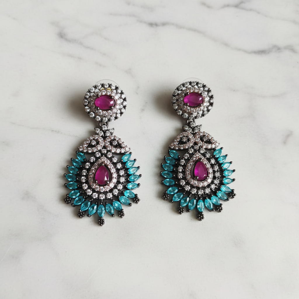 Ruby chandelier drop earrings editorial promotional image on marble