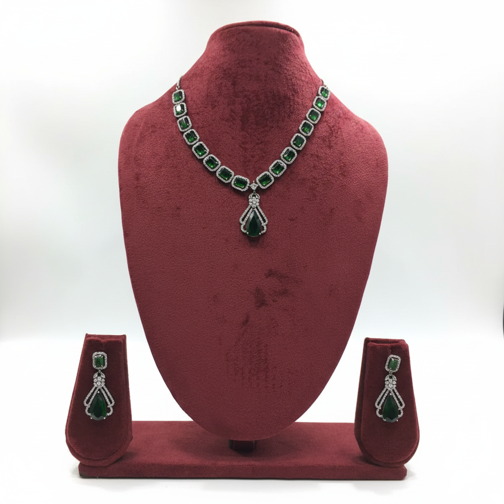 Emerald cushion-cut AD necklace set on burgundy velvet display