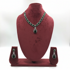 Emerald cushion-cut AD necklace set on burgundy velvet display