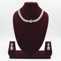 Rose pink AD pave disc necklace set on burgundy velvet display