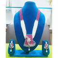 Ruby pink bead and pearl AD floral pendant long necklace set on navy velvet display