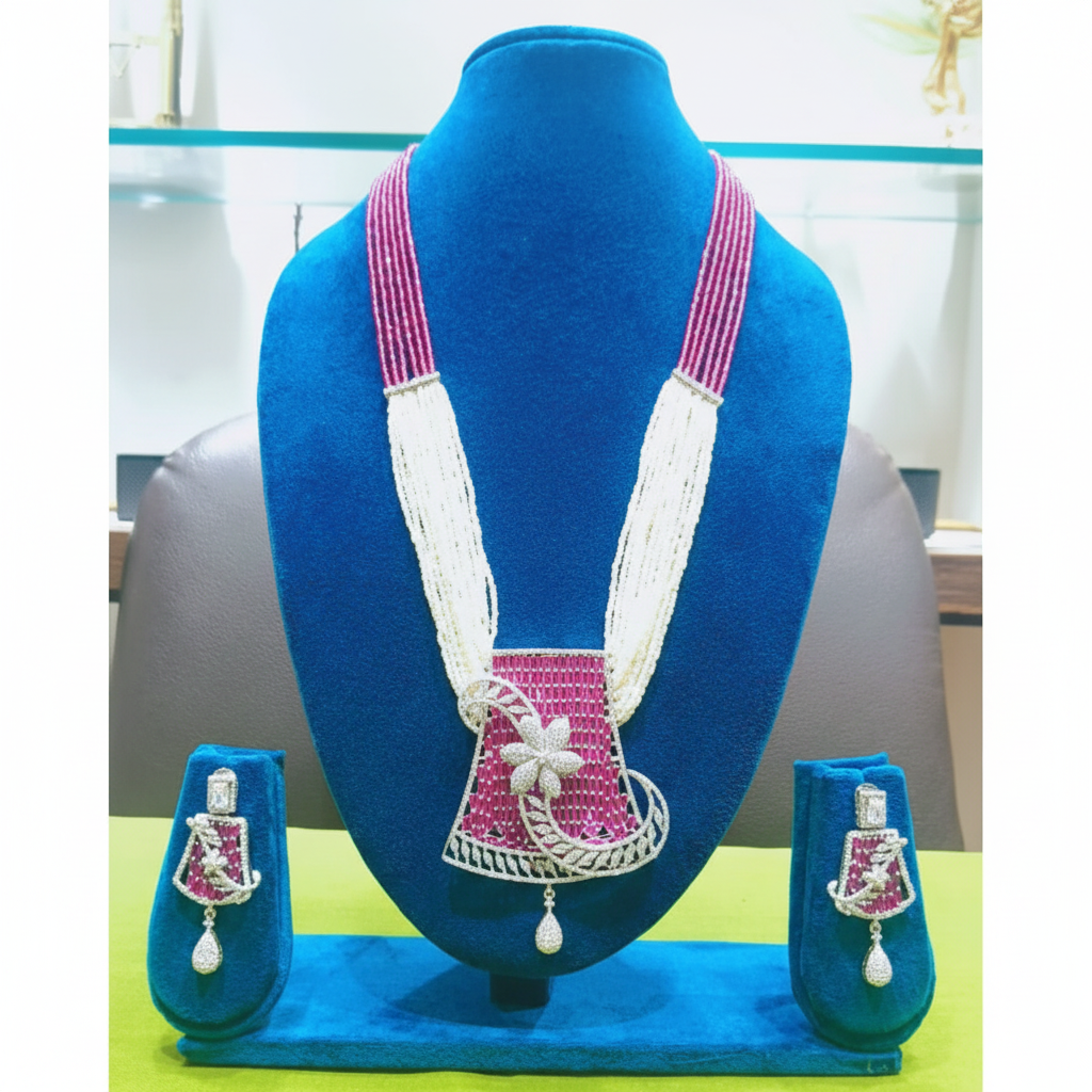 Ruby pink bead and pearl AD floral pendant long necklace set on navy velvet display