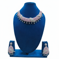 Pink and white AD pave twisted rope choker necklace set on navy velvet display