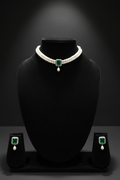 Seed pearl choker with emerald square AD pendant on dark velvet studio display